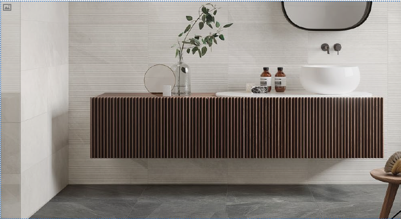 A bathroom with large-format wall and floor tiles